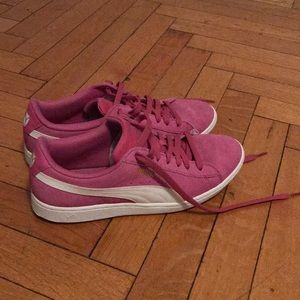 Pink and white Puma sneakers.